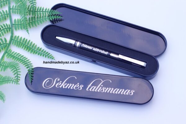 Pen and a metal case ,,Sekmes talismanas,,